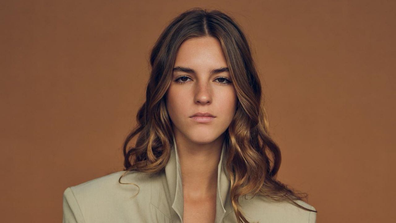 Emily Feld showcases the ultimate minimalist chic look with a structured, neutral-toned blazer that perfectly embodies timeless editorial tailoring.