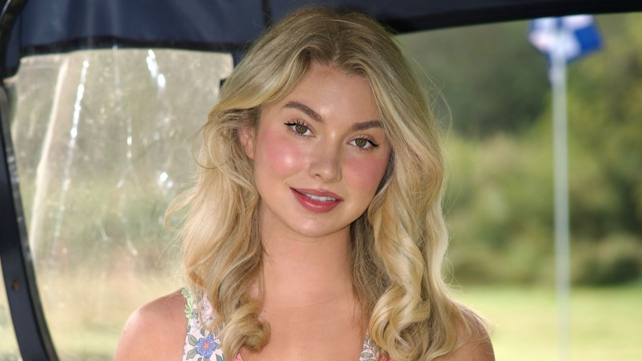 Highlighting a radiant natural beauty aesthetic, Lucy Robson pairs effortless blonde waves with a delicate floral print top that is perfect for seasonal style inspiration.