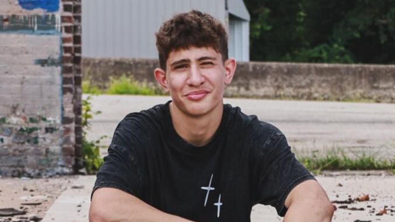 Nidal Wonder effortlessly captures a modern streetwear aesthetic with a relaxed, washed-black graphic tee that perfectly combines urban comfort with edgy casual style.