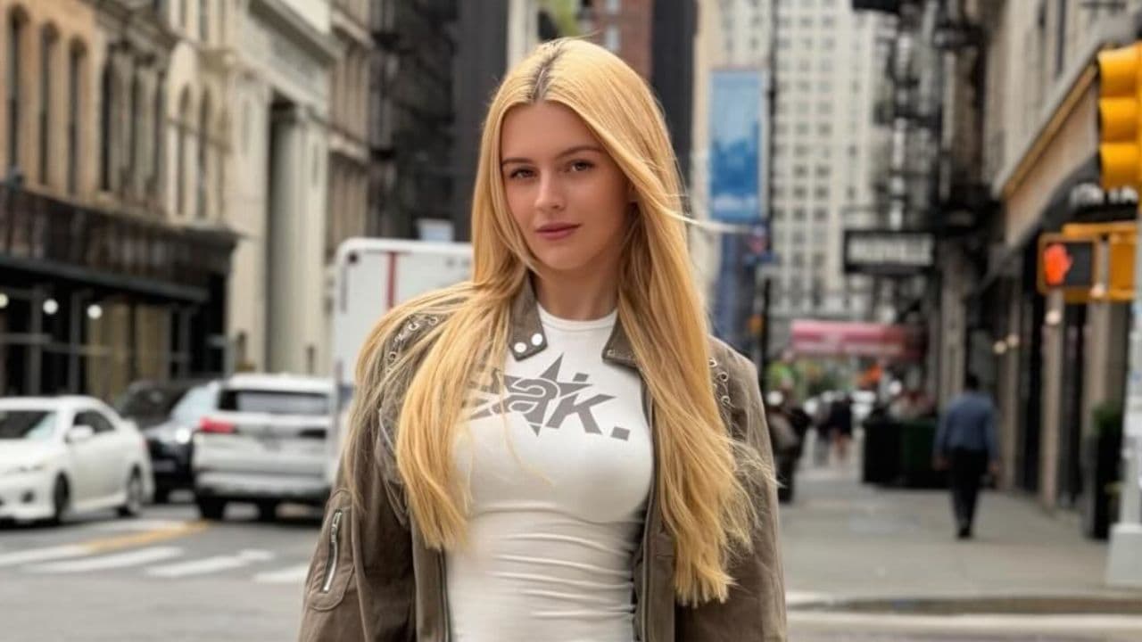 Vera Dijkmans effortlessly blends casual comfort with urban edge by layering a fitted graphic tee under a lightweight utility jacket for a modern street-style look.