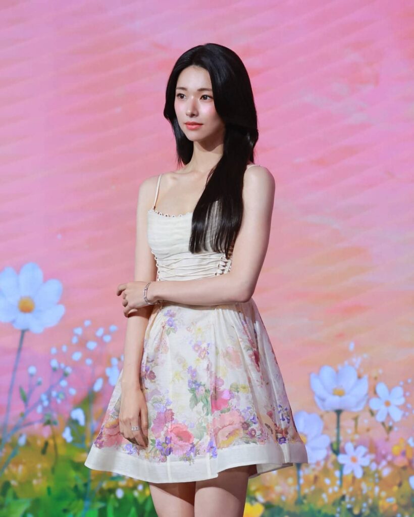 Embodying ethereal feminine romance, Ha Young shines in a delicate floral corset sundress featuring soft pastel blossoms and slender straps, ideal for spring and summer luxury styling.