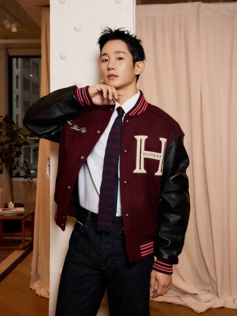 Bringing ultimate cool-girl energy, Hae In rocks a collegiate-chic vibe in a bold maroon and black varsity jacket paired effortlessly with dark denim.