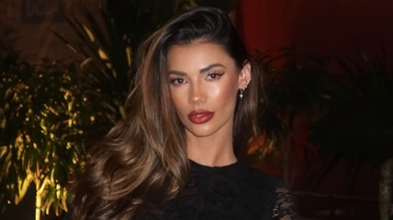 Tiffany Keller pairs a delicate black lace evening look with radiant soft-glam makeup and voluminous, blowout waves for an effortlessly polished nighttime aesthetic.
