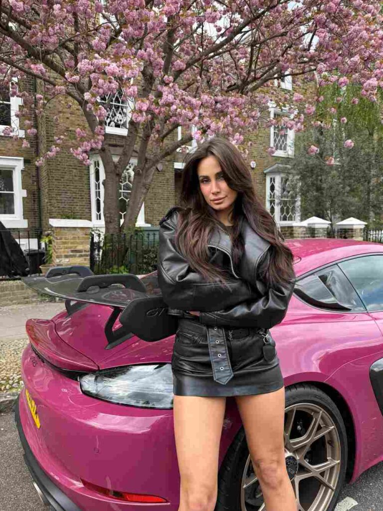Violeta Mihaylova channels bold street-style chic by pairing an oversized black leather moto jacket with a matching belted mini skirt for an effortlessly elevated, edgy aesthetic.